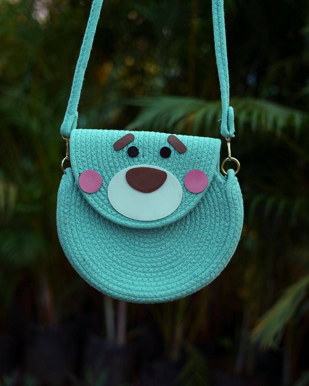 Mint green round sling bag with adjustable strap